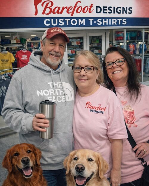 Barefoot Designs storefront with the owners and their dogs